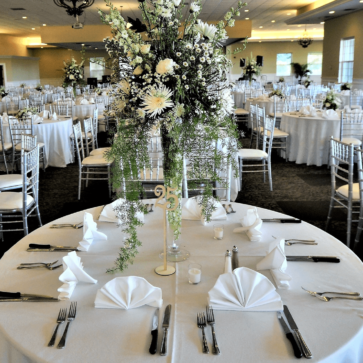 Banquet hall with table settings and centerpieces for wedding reception